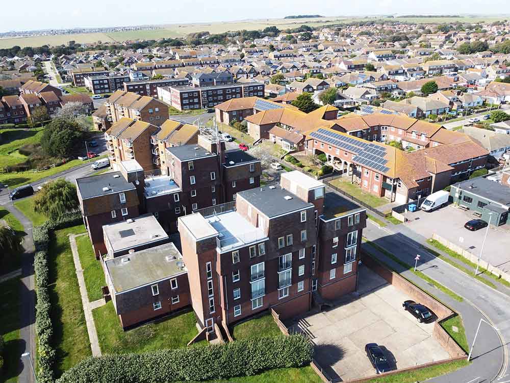An apartment block surrounded by residential properties