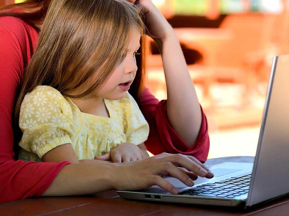 mother and child on a laptop